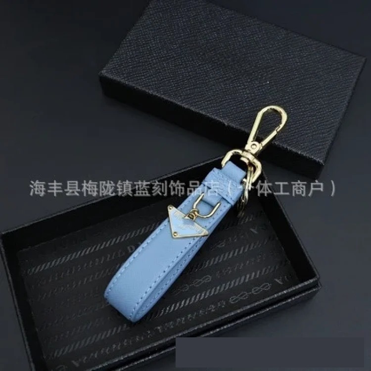 Pujia's new triangle logo keychain light luxury leather multi-color metal simple home pendant dropshipping image 5